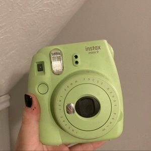 Mint green polaroid camera